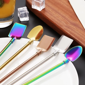 304 stainless steel straw spoons in shovel shapes with vibrant metallic finishes on a tray
