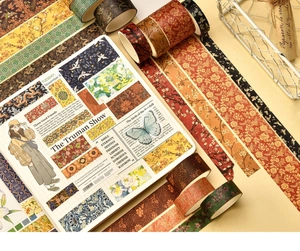 Detail of vintage floral Washi tape set and stickers on warm beige journal paper