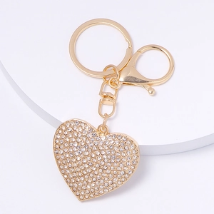 Close-up of gold heart keychain with sparkling crystal inlay and lobster clasp hook