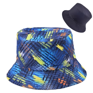 Close-up of reversible bucket hat showing graffiti print and solid dark inner lining
