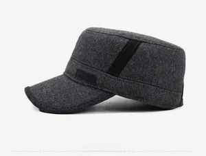 Detail view of dark grey winter cadet cap featuring a SPORT leather label and woven texture
