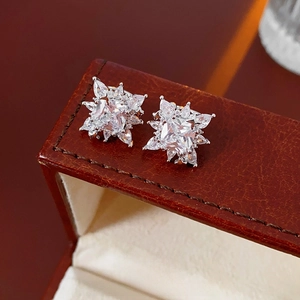 Sparkling snowflake zircon ear cuffs featuring a large square center stone in silver