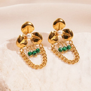 Gold floral tassel earrings with white pearls and green malachite beads on stone