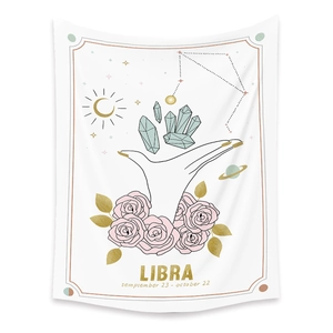 Detail of Libra zodiac wall tapestry featuring artistic gold and pink hand-drawn line art