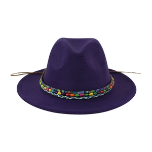 Detail of purple wool fedora featuring ethnic colorful beaded band and woven texture