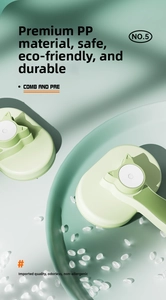 Detail of light green cat ear grooming brush made of durable eco-friendly PP material