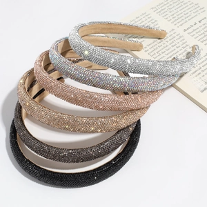 Close-up of luxury padded headband featuring sparkling rhinestones and non-slip lining