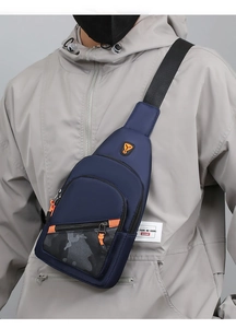 Detailed view of blue nylon sling bag with camouflage pockets and adjustable black strap