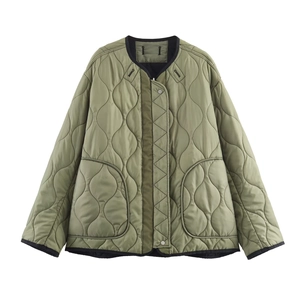 Army green reversible quilted jacket for women with black trim and side pockets
