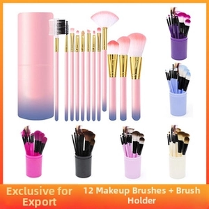 Close-up of 12-piece makeup brush set with various brush heads and matching storage bucket
