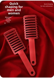 Detail of red vented hair brushes with nylon bristles and massage tips on red silk