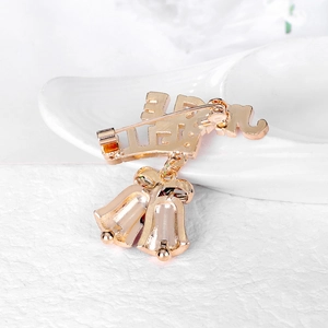 Rose gold Christmas bell brooch with Jingle letters and metallic double bell pendants