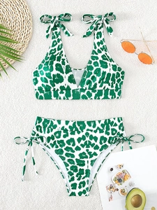 Detailed shot of green leopard print ribbed bikini set with adjustable side-tie bows