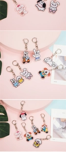 Detailed collage of cute acrylic animal keychains including white puppy and rabbit charms