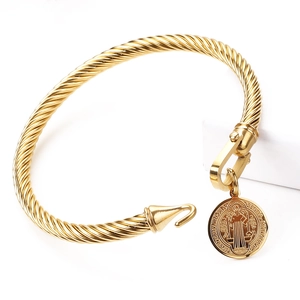 Golden stainless steel twisted cable bracelet with St. Benedict religious medal charm