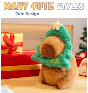Close-up of Capybara plush toy wearing a green Christmas tree hat with festive star