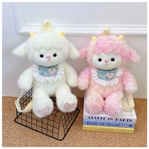 Detail of plush sheep backpacks in white and pink with blue lace bibs and straps