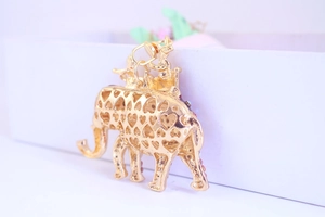 Detailed close-up of elephant keychain with hollow heart patterns and colorful rhinestones