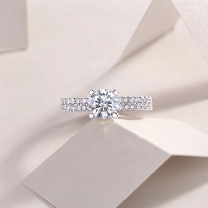 Classic S925 sterling silver ring with 1 carat round diamond on a modern geometric background