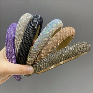 Macro view of crystal headband set with hand-set rhinestones and padded sponge texture