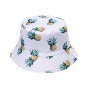 Detailed view of white bucket hat featuring tropical pineapple prints and multi-row stitching