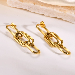 Minimalist gold titanium steel chain earrings with four interlocking oval links on silk