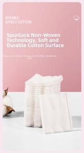 Macro shot of 222-count disposable white facial cotton pads with spunlace nonwoven texture