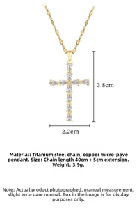 Detail of gold cross pendant with cubic zirconia, size 3.8x2.2cm on titanium steel chain