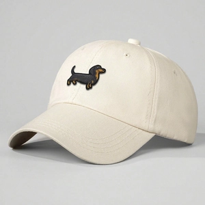Beige baseball cap featuring 3D embroidered dachshund with adjustable curved brim design