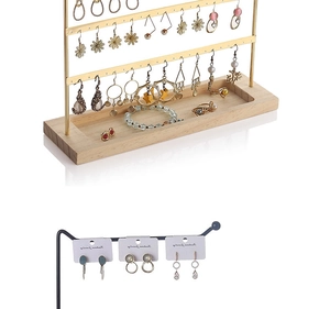 Detail of iron earring organizer with wooden base and tiered storage rack structure