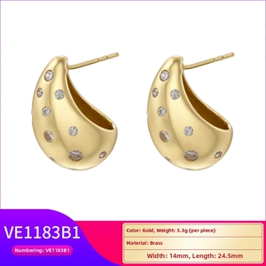Detail view of gold-plated brass teardrop earrings with sparkling cubic zirconia inlay