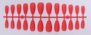 Macro detail of 24-piece matte red teardrop almond false nails on a professional plastic frame