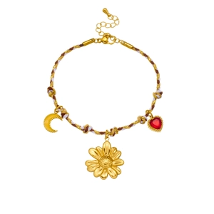 Bohemian braided rope bracelet with gold flower, moon, and heart charms on a white background