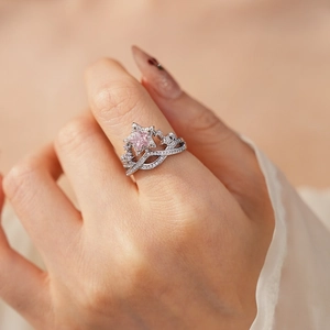 Detail of pink star zircon ring set with elegant silver plating and stacked design
