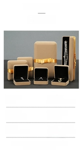 Detailed view of beige velvet jewelry boxes with yellow satin bows for storage and gifting