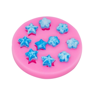 Pink silicone mold featuring star and flower shapes for dessert fondant and chocolate decoration
