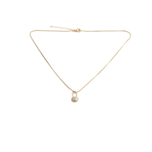 Elegant gold heart lock necklace with micro-pave cubic zirconia on a white background