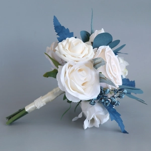 Artificial bridal bouquet with cream roses, blue berries and white lace handle