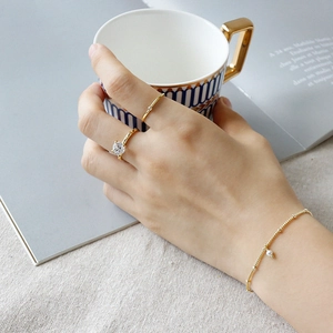 Elegant gold S925 silver beaded bracelet with pearl pendant and crystal rings