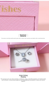 Pink jewelry gift box with silver necklace, earrings, and ring set with white zircons