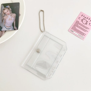 Close-up of clear PVC card holder with silver ball chain and secure snap button closure