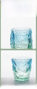 Detail view of glacier texture glass cup featuring a blue-green gradient and thick rim