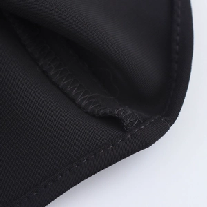 Close-up of black sleeveless dress fabric texture and professional stitching details