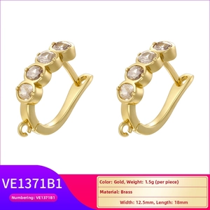 Detail view of gold-plated U-shape brass earring hooks with zircon inlays and loop