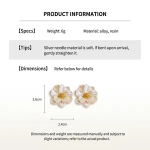 Detail view of pearl luster floral resin earrings with silver needles and size specs