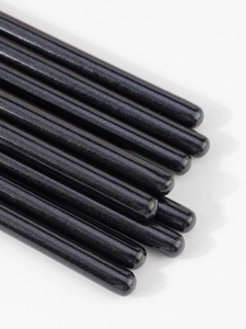 Macro shot of silver glitter coating on professional eyeshadow blending brush handles