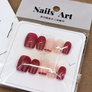 Handmade burgundy wine red press-on nails set with elegant heart-shaped rhinestones