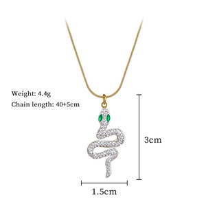 Detail of titanium steel snake pendant with green gem eyes and technical dimensions