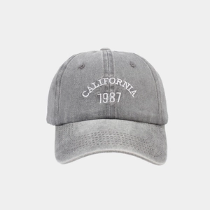 Detail of CALIFORNIA 1987 embroidery on washed dark grey vintage cotton baseball cap