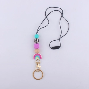 Silicone beaded lanyard with rainbow pendant, leopard beads and gold keychain hardware